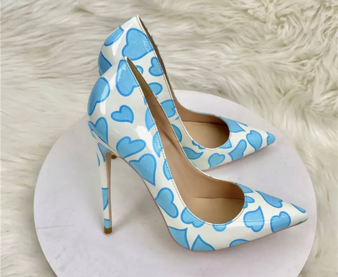 White high heeled shoes with blue hearts
