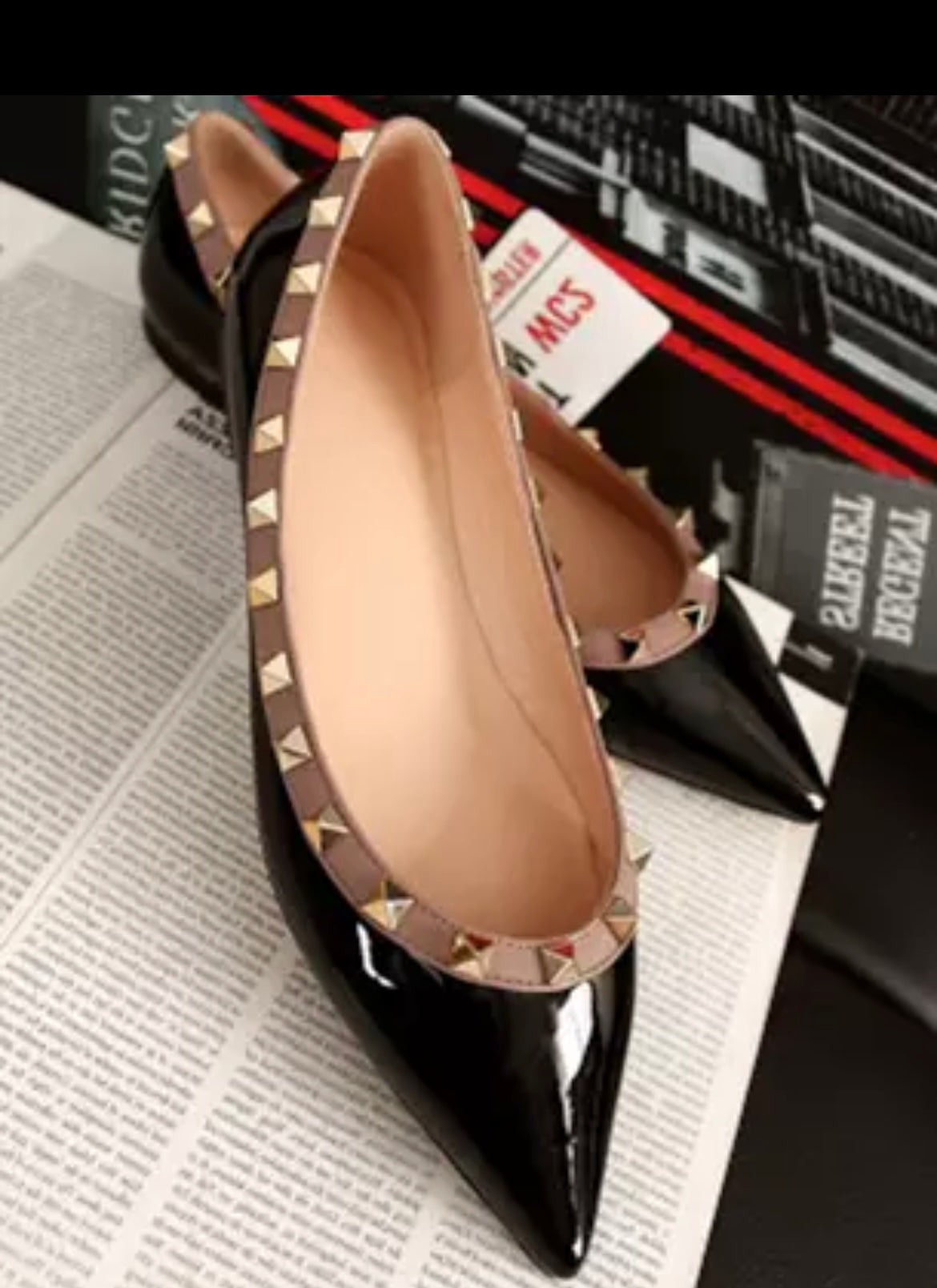 Black flats pumps with gold rivet studs
